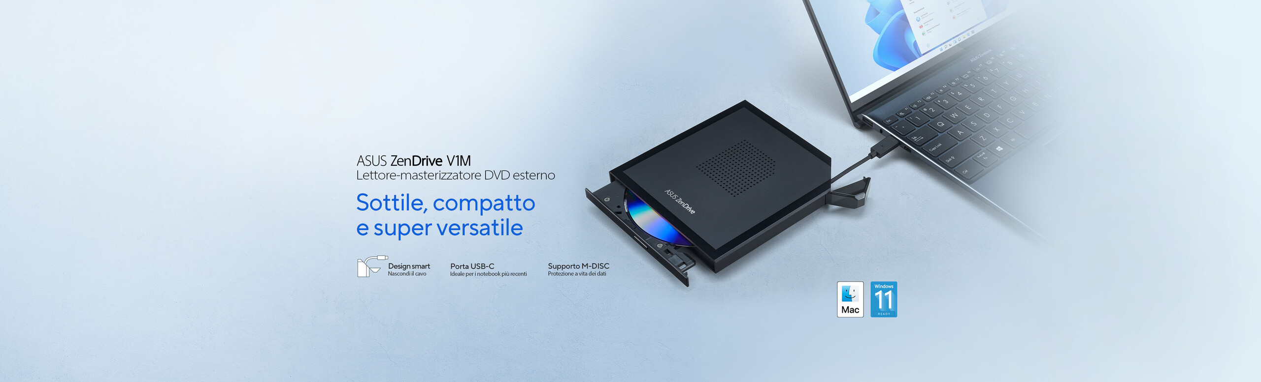L'immagine mostra un lettore-masterizzatore DVD esterno ASUS ZenDrive V1M collegato a un computer portatile tramite una porta USB-C. Accanto al dispositivo c'è un disco inserito parzialmente.